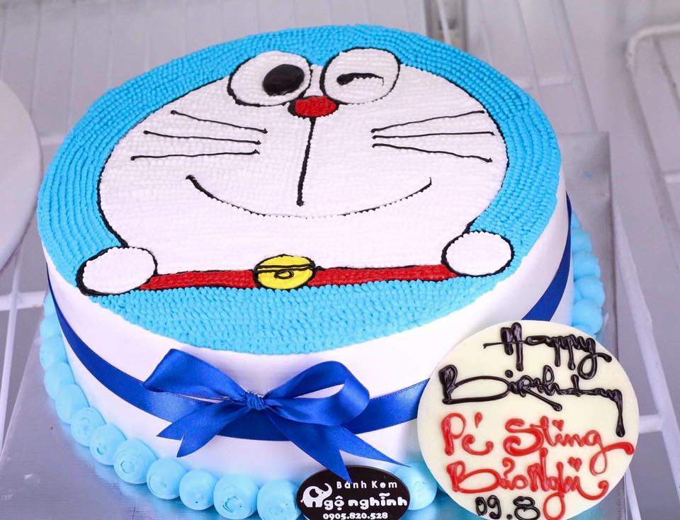 Bánh kem màu trắng in hình cao bồi Doremon và Nobita - Bánh Thiên Thần :  Chuyên nhận đặt bánh sinh nhật theo mẫu